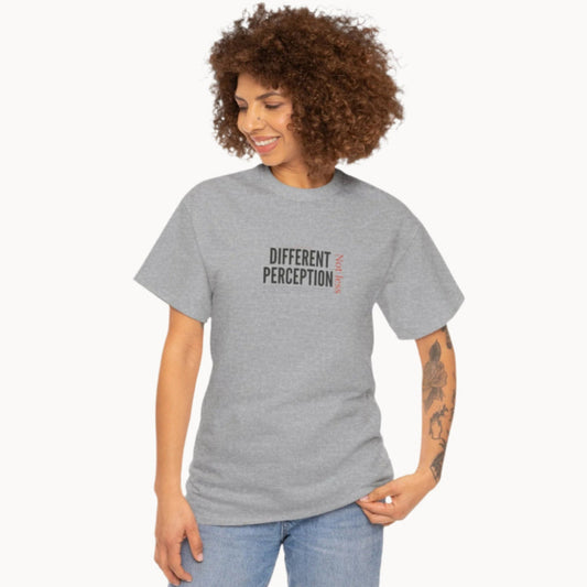 Woman in grey t shirt with words Different Perception Not Less on front