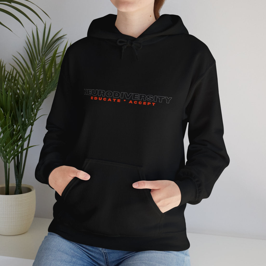 Young woman in black Educate Accept neurodiversity hoodie hands in pockets